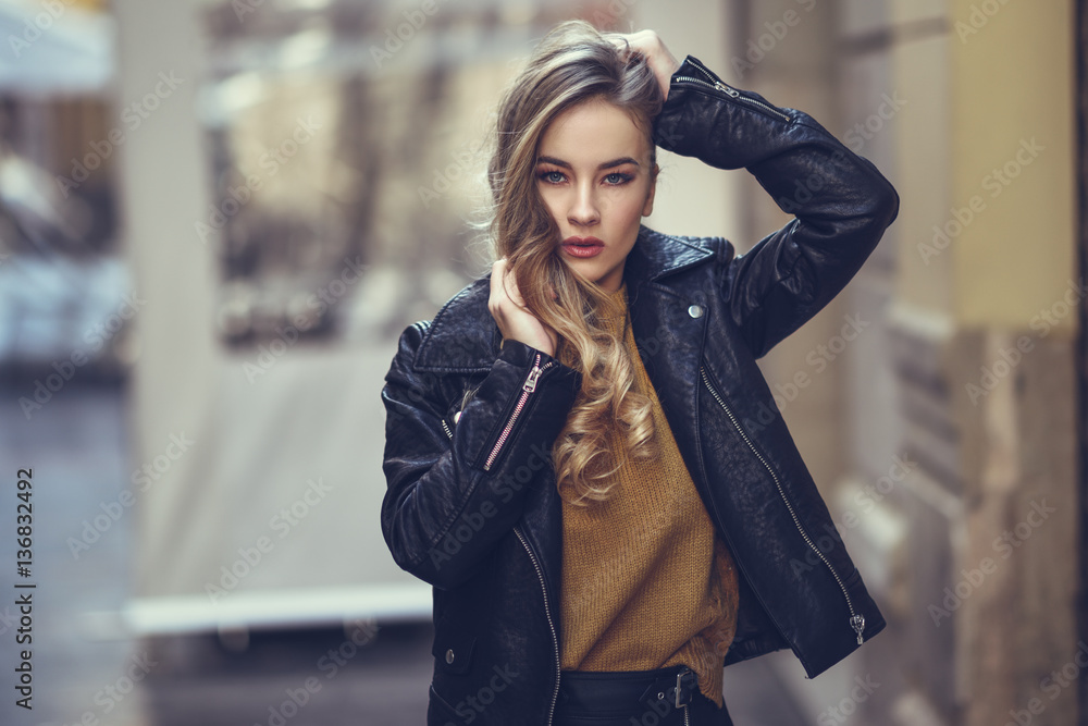 Beautiful blonde russian woman in urban background Beautiful blonde russian woman in urban background