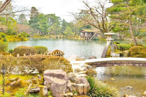 Kasumigaike pond and stone lantern in Kenroku-en garden photo