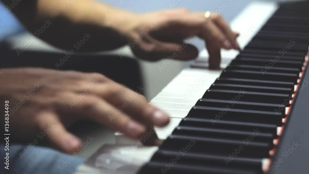 Playing piano. Close Up view. Two hands playing the piano.