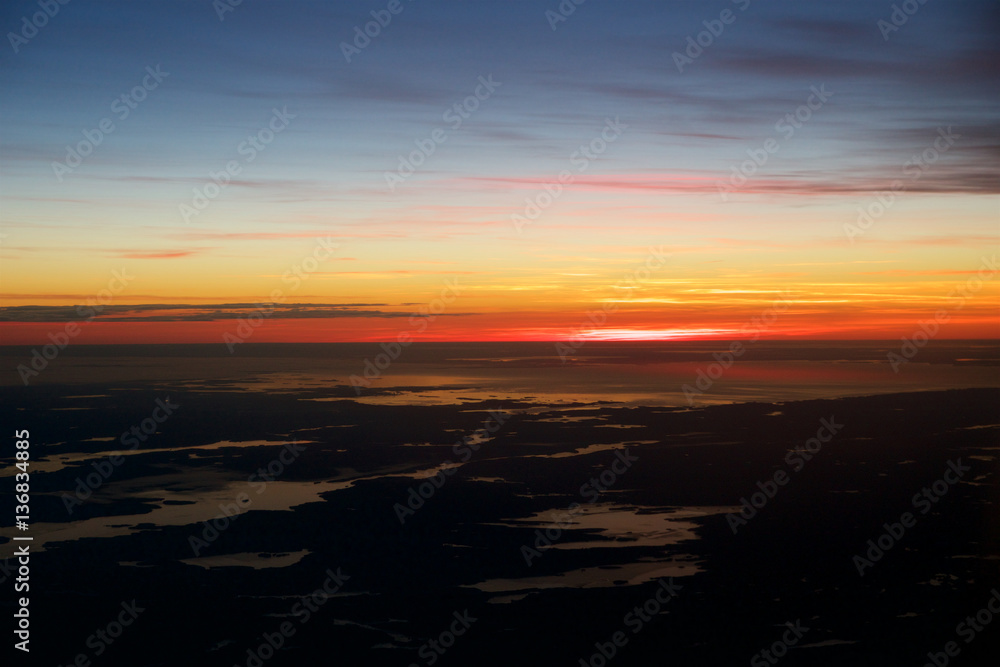 OSLO, NORWAY - JAN 21st, 2017: View off the sunrise, norway during winter from inside the plane during my Lufthansa business class flight to Munich.