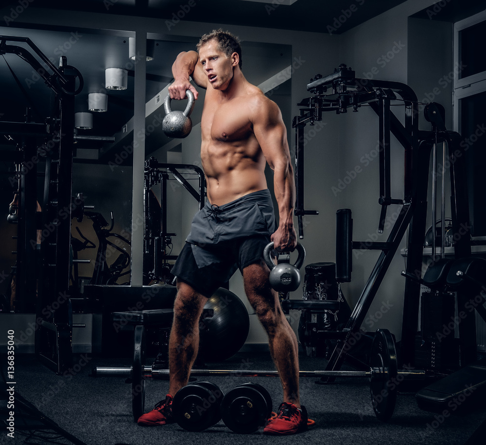 A man doing shoulders workouts. A man doing shoulders workouts.