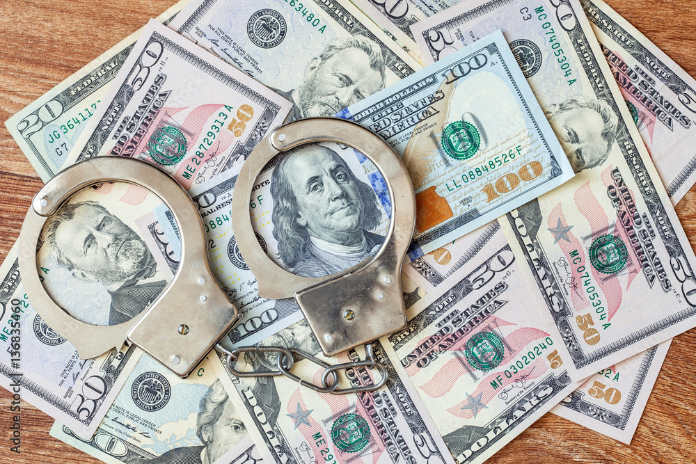 The dollars and handcuffs. The dollars and handcuffs.