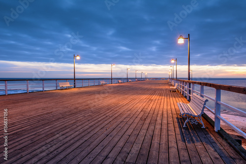 Cold evening at the pier in Jastrania in winter time. Poland. 