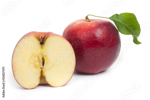 Red apple and a half isolated on a white background, close-up.