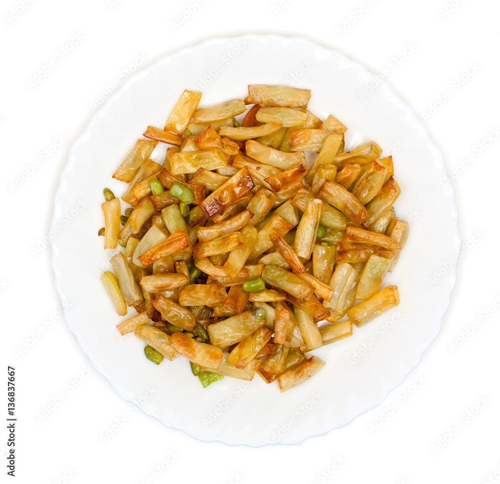 Slices of fried green beans on a plate top view Slices of fried green beans on a plate top view