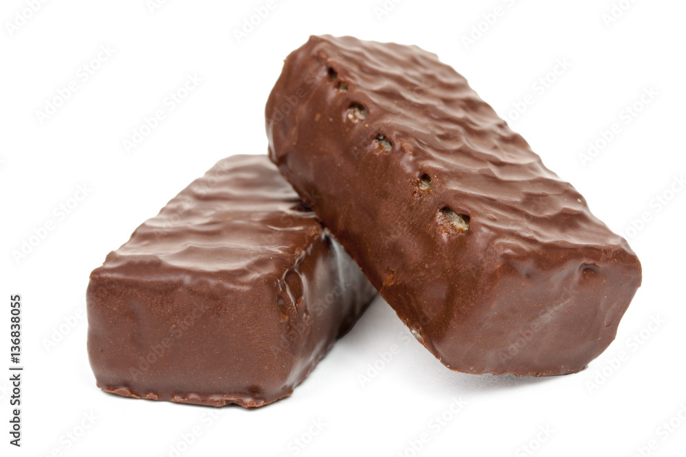 Two chocolate candies isolated on white background, close-up. Two chocolate candies isolated on white background, close-up.