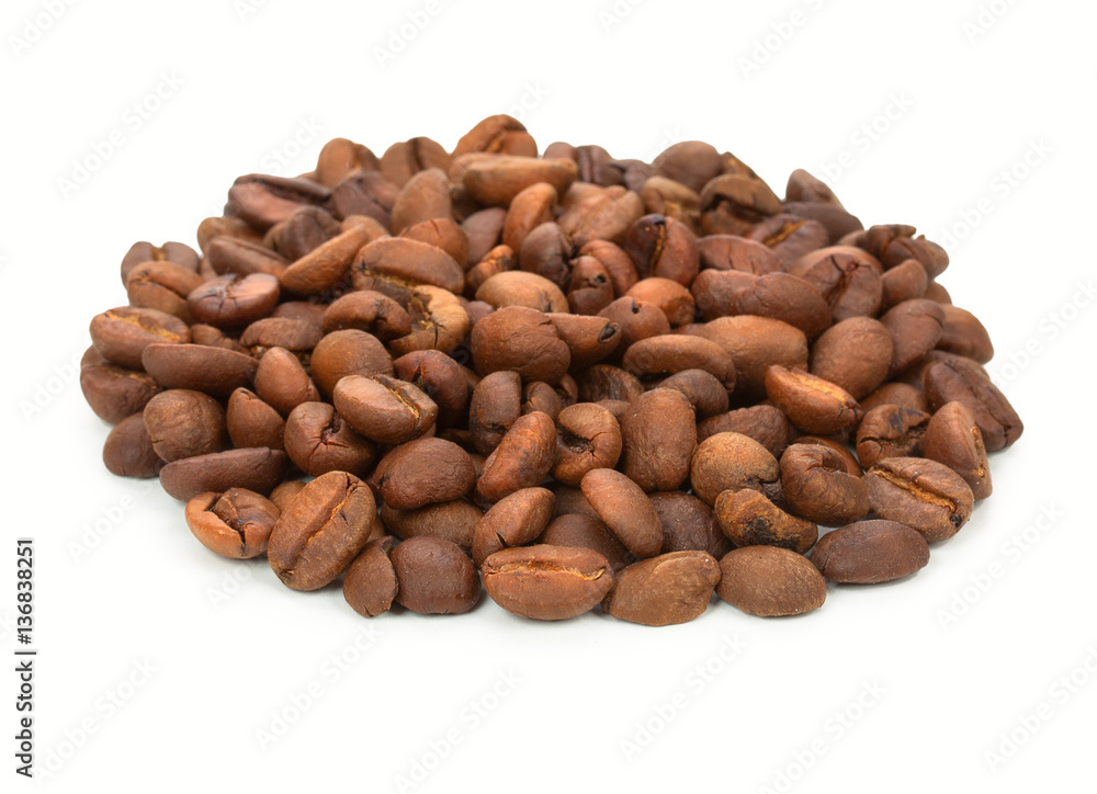 Heap of roasted coffee beans pile from top, isolated on white ba Heap of roasted coffee beans pile from top, isolated on white ba