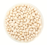 White beans in round plate isolated on a white background top vi