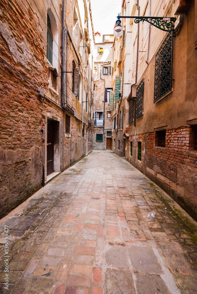Small street in  Venice (Italy