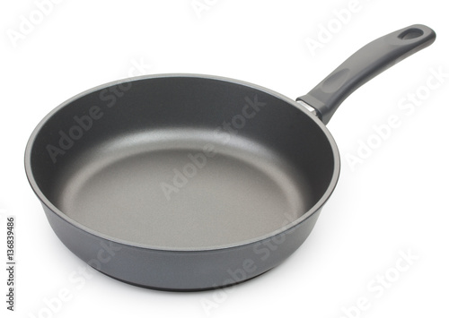 Black frying pan isolated on white background, close-up.