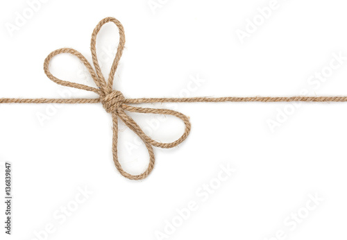 Rope with bowknot, isolated on white background, close-up.