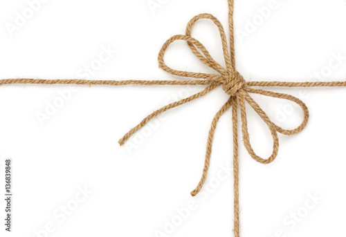 Rope with bowknot, isolated on white background, close-up.