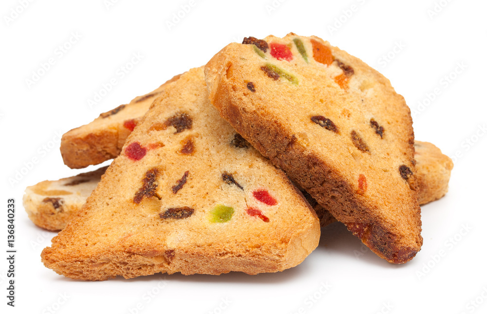 Heap of rusks with candied fruit, isolated on a white background Heap of rusks with candied fruit, isolated on a white background