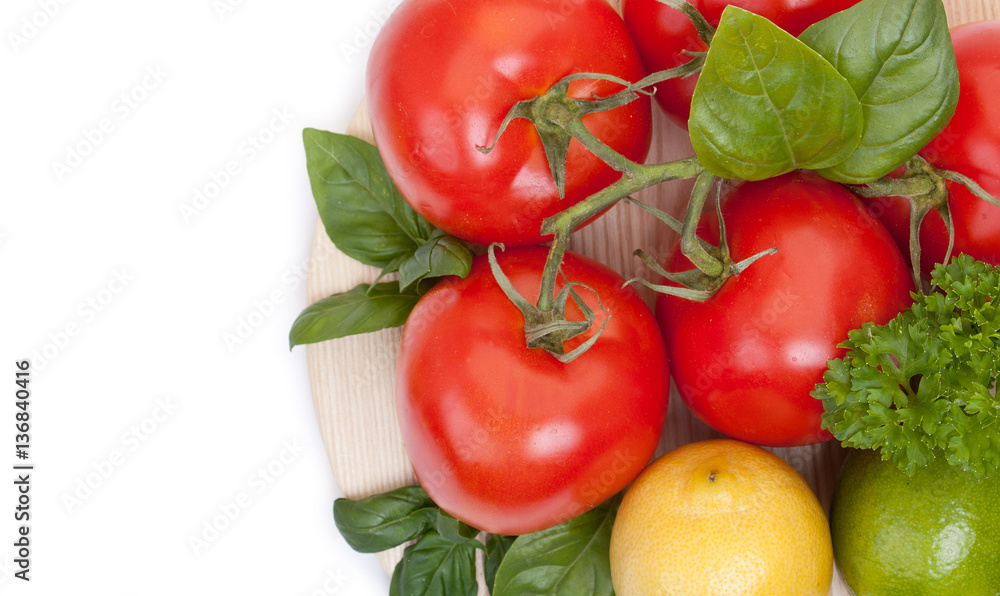 Branch of fresh tomatoes, lime and lemon with fresh parsley and Branch of fresh tomatoes, lime and lemon with fresh parsley and