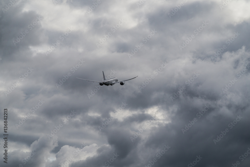 The airplane is ascending in the bad weather The airplane is ascending in the bad weather
