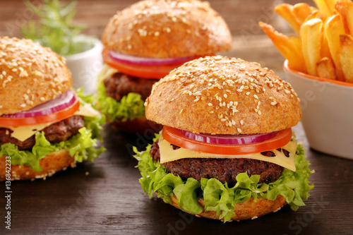 Hamburger with beef meat and fresh vegetables