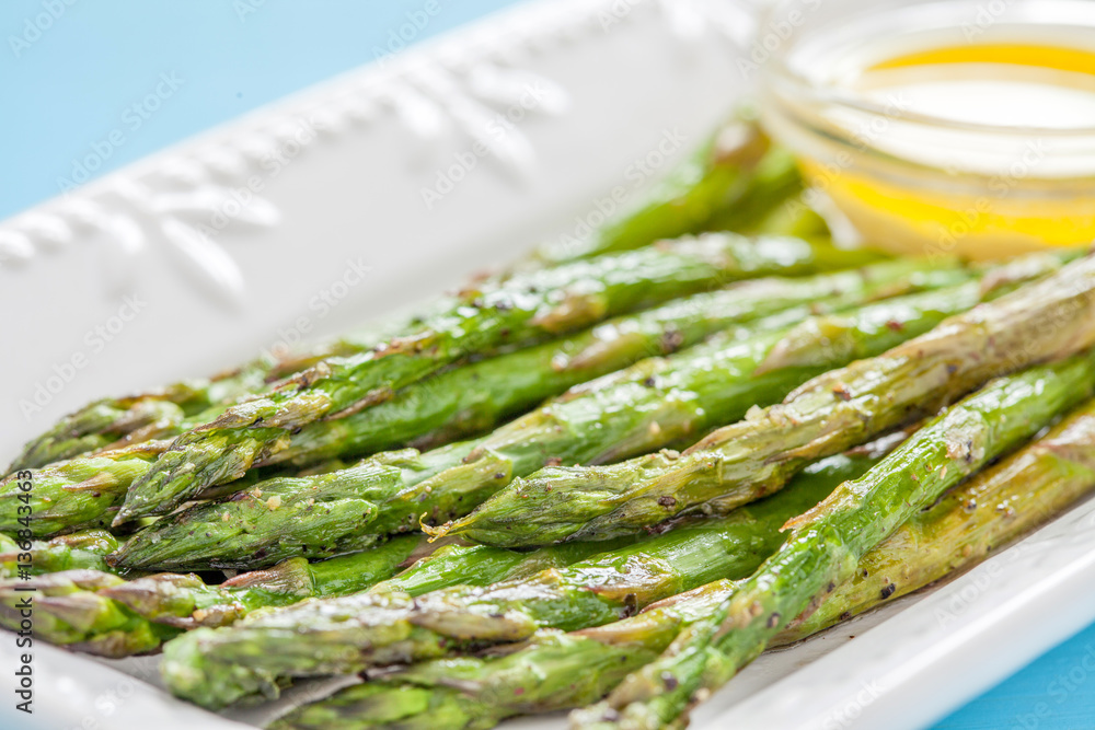 Fototapeta premium Roasted Asparagus on a White Plate