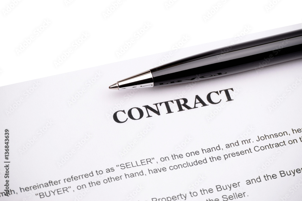 Close-up of pen on contract