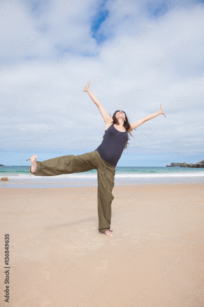 brunette brown hair pregnant woman with grey shirt green trousers and black sunglasses happy dancing in summer on sand beach ocean in Asturias Spain
brunette brown hair pregnant woman with grey shirt green trousers and black sunglasses happy dancing in summer on sand beach ocean in Asturias Spain