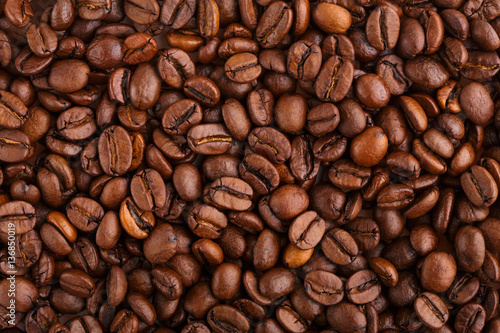 roasted coffee beans isolated in white background. Roasted coffee beans background close up. Coffee beans pile from top on white background with copy space for text. Good morning.