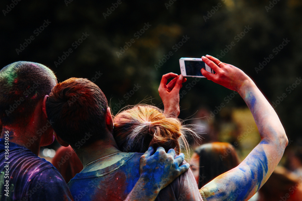 happy people taking selfie photo mobile at holi fest, festiva Stock Photo | Stock