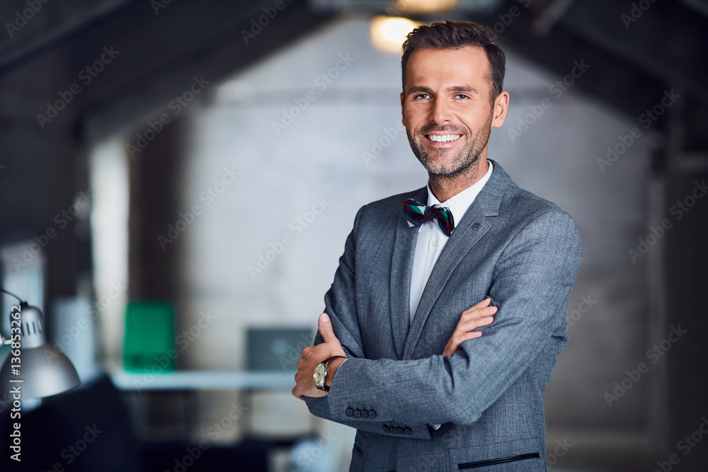 Successful manager, businessman standing in office Successful manager, businessman standing in office
