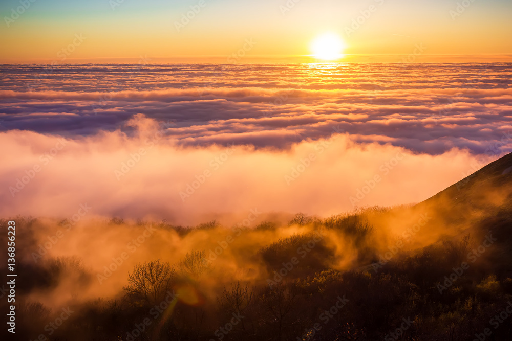 Obraz premium Beautiful sunset with clouds and mountains. On high.