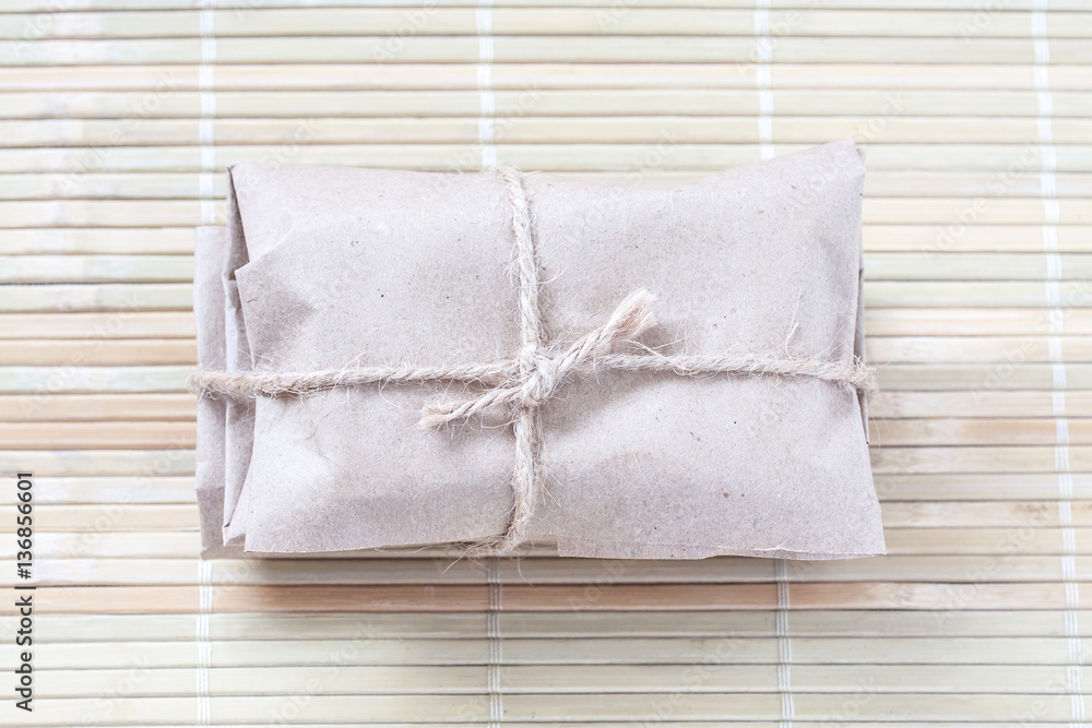 Wrapped parcel, paper package tied with burlap rope. Wrapped parcel, paper package tied with burlap rope.