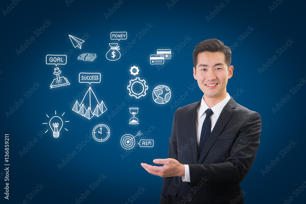 Success businessman showing business icon and chart concept Success businessman showing business icon and chart concept