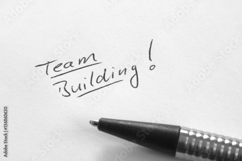 Team Building, handwritten phrase on white paper