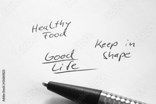 Good life, healthy food, keep in shape, handwritten phrase on white paper