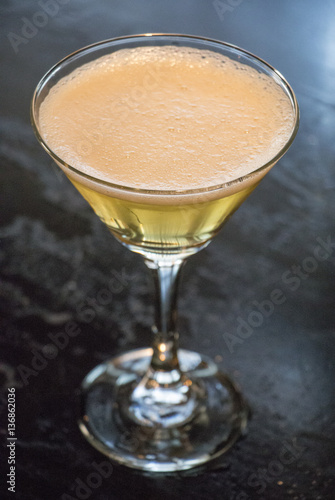 Yellow martini on black table