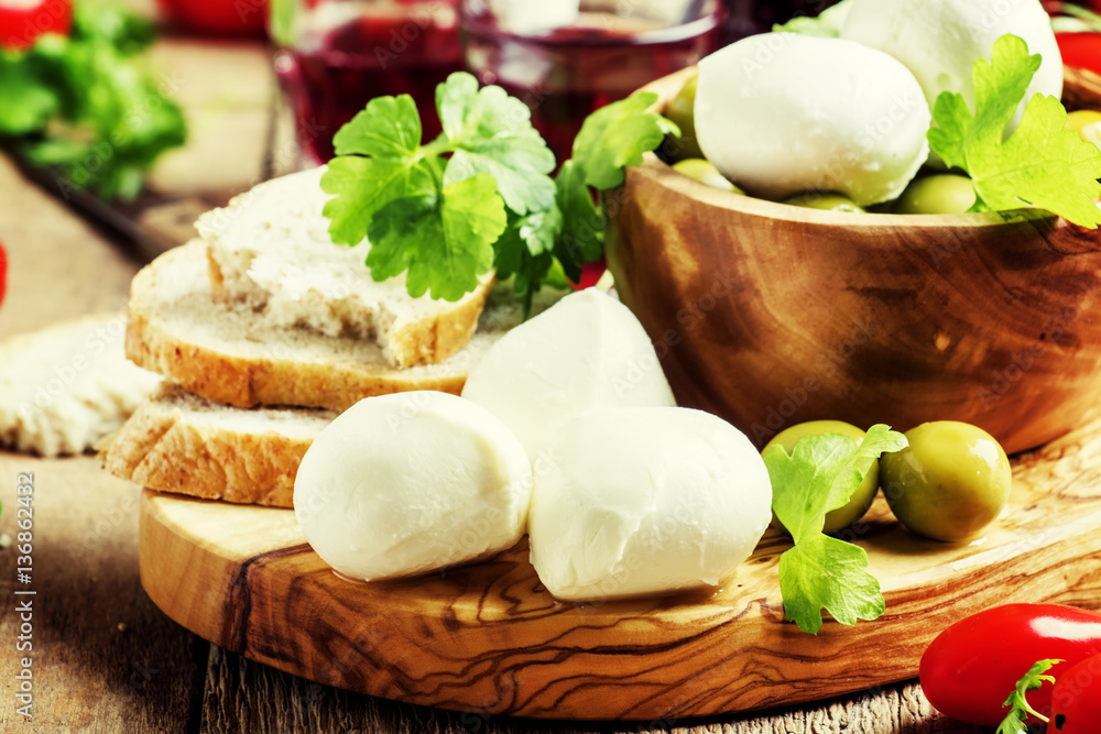 Mozzarella cheese, bread, olives and tomatoes, snack plate. Vint Mozzarella cheese, bread, olives and tomatoes, snack plate. Vint