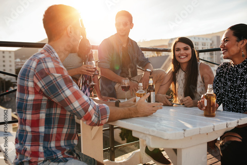 Group of friends having a rooftop party
