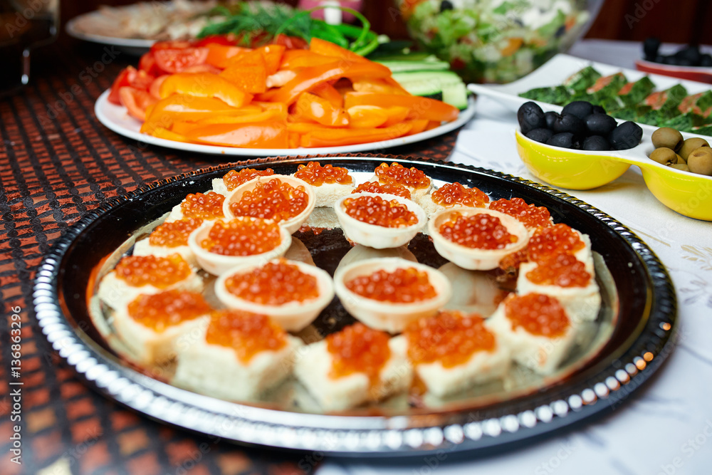 tartlets with caviar on a table in a restaurant tartlets with caviar on a table in a restaurant