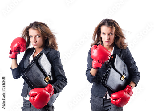 Young woman with boxing gloves isolated on white © Elnur