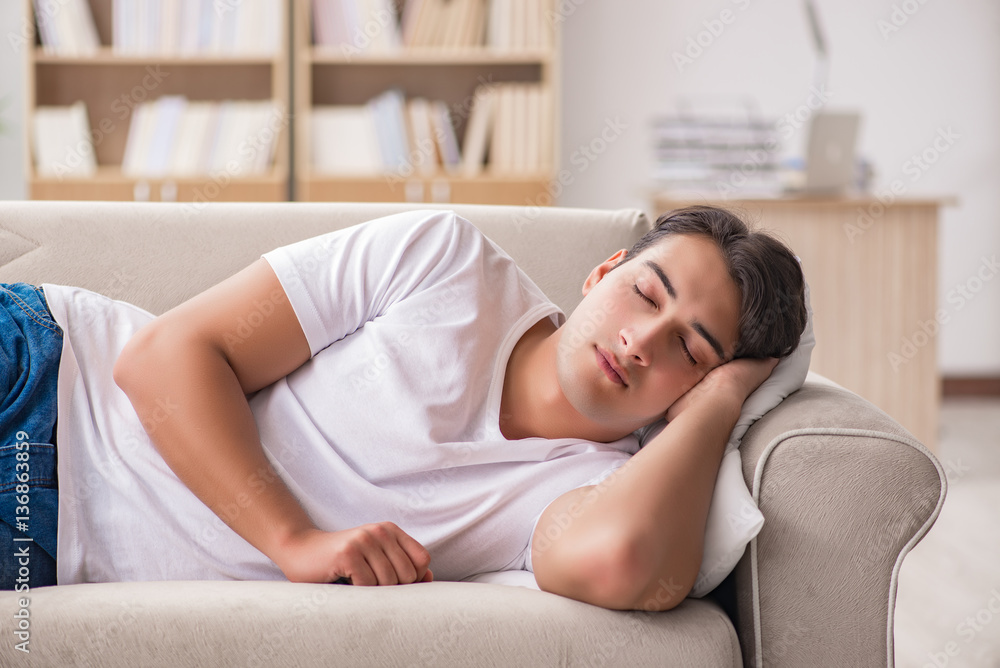 Young man sleeping in sofa couch Young man sleeping in sofa couch
