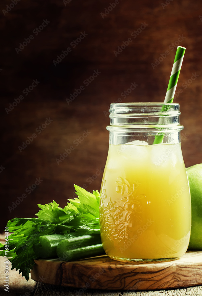 Freshly squeezed juice with celery, green apple and ice. Vintage Freshly squeezed juice with celery, green apple and ice. Vintage