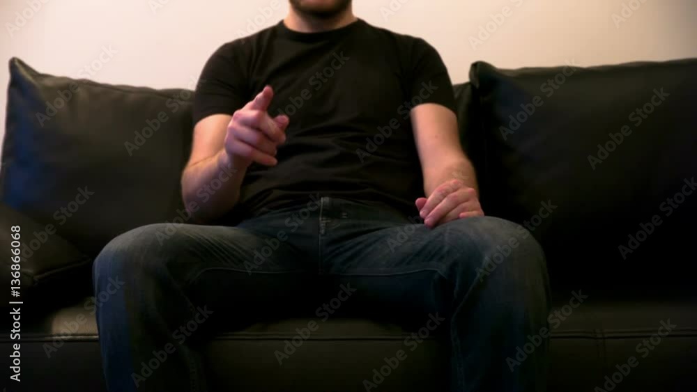 A young man watching tv A young man watching tv