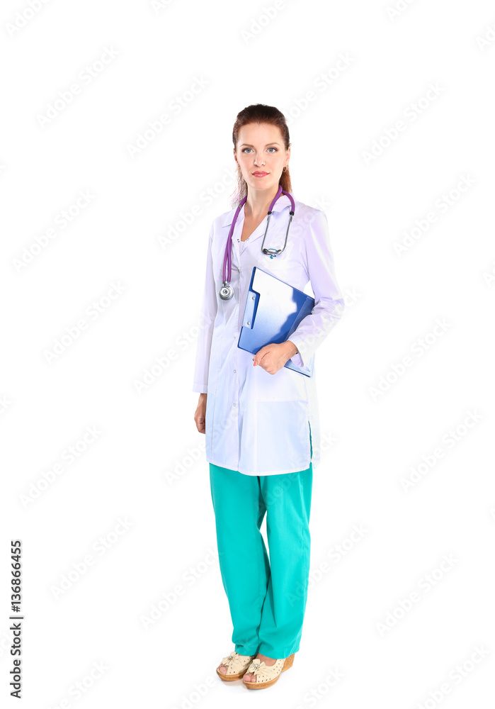 Smiling female doctor with a folder in uniform standing at hospital Smiling female doctor with a folder in uniform standing at hospital