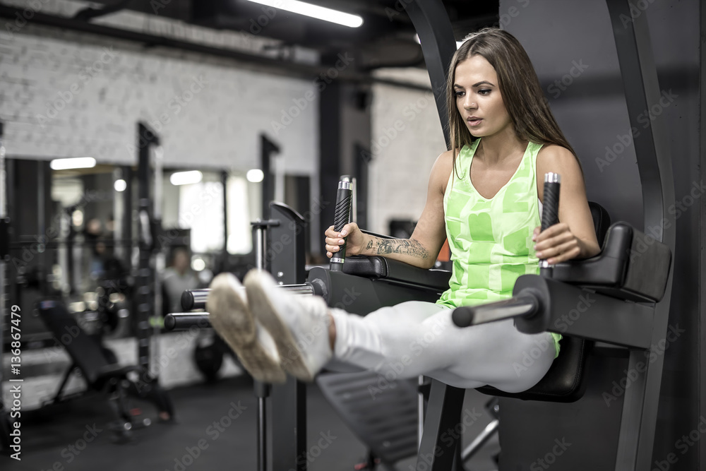 Training of athletic girl in gym Training of athletic girl in gym