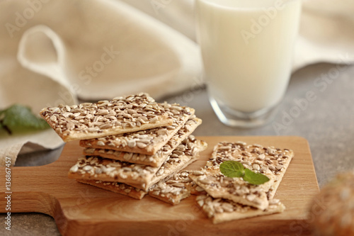 Delicious cereal cookies on cutting board, closeup