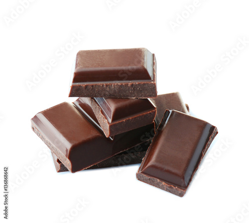 Broken chocolate pieces on white background