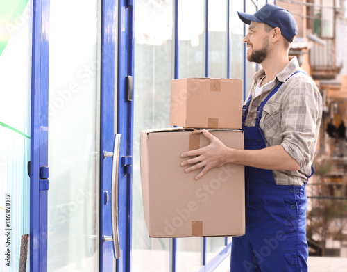House moving concept. Man h...