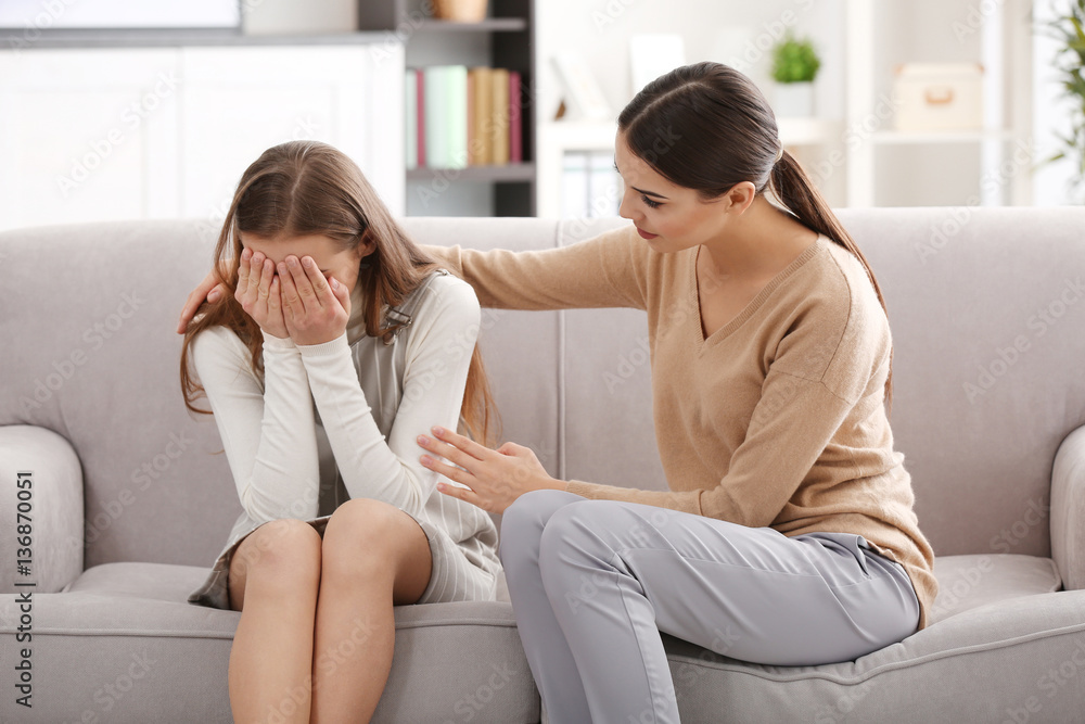 Young female psychologist working with teenager girl in office Young female psychologist working with teenager girl in office