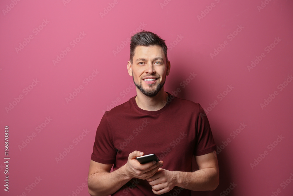 Handsome young man posing on color background Handsome young man posing on color background