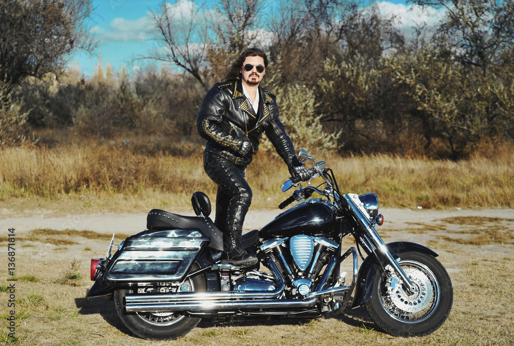 Naklejka premium Stylized photo of man and bike