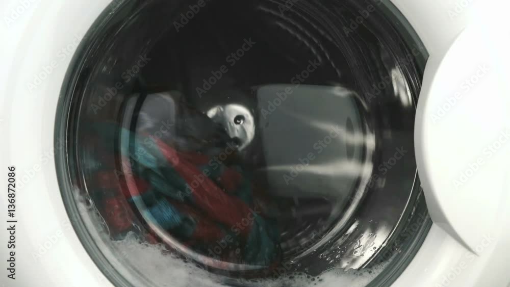 Home electronics. The process of working of the washing machine during wash program. Close-up Home electronics. The process of working of the washing machine during wash program. Close-up