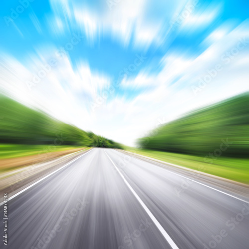Country road in motion blur. © Elena Volkova