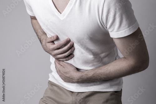 young man having a stomachache